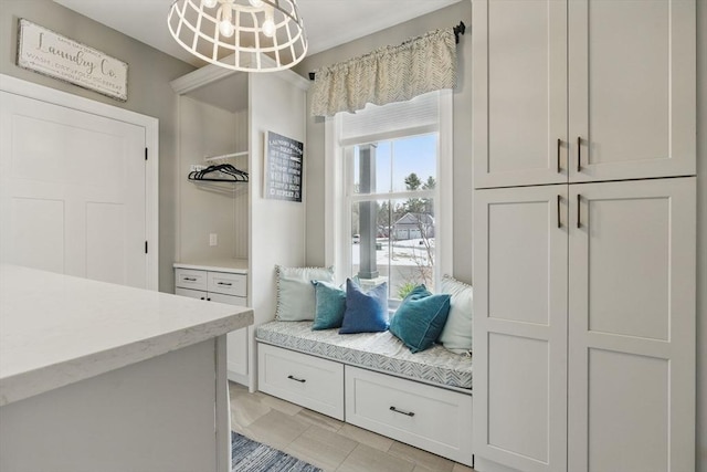 mudroom with a notable chandelier