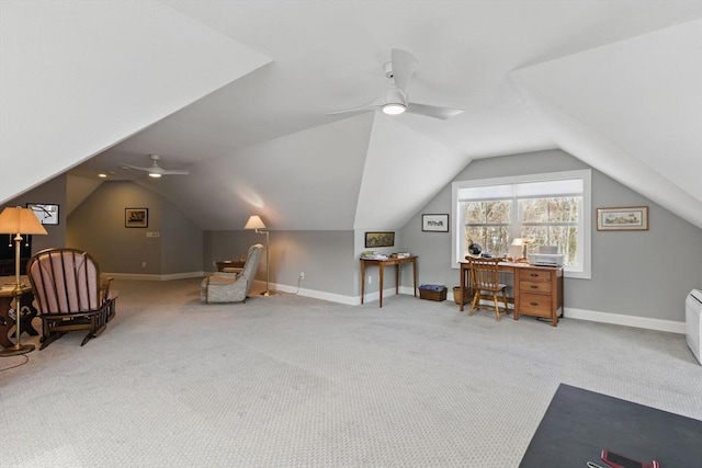 sitting room featuring ceiling fan, carpet floors, vaulted ceiling, and baseboards