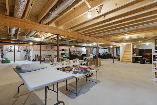 basement featuring stairs