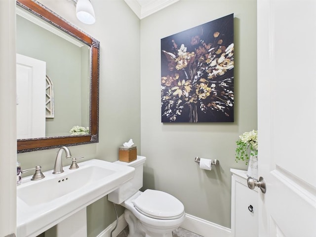 20 Davenport Ln Unit 20, Hopkinton, MA 01748 - half bathroom featuring toilet, a sink, ornamental molding, and baseboards