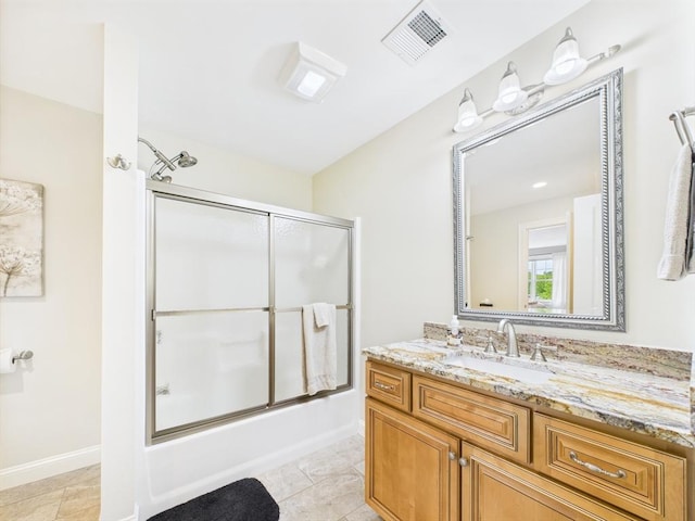 20 Davenport Ln Unit 20, Hopkinton, MA 01748 - bathroom featuring bath / shower combo with glass door, vanity, baseboards, and tile patterned floors