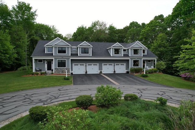 20 Davenport Ln Unit 20, Hopkinton, MA 01748 - view of front of home with asphalt driveway, a front lawn, an attached garage, and stone siding