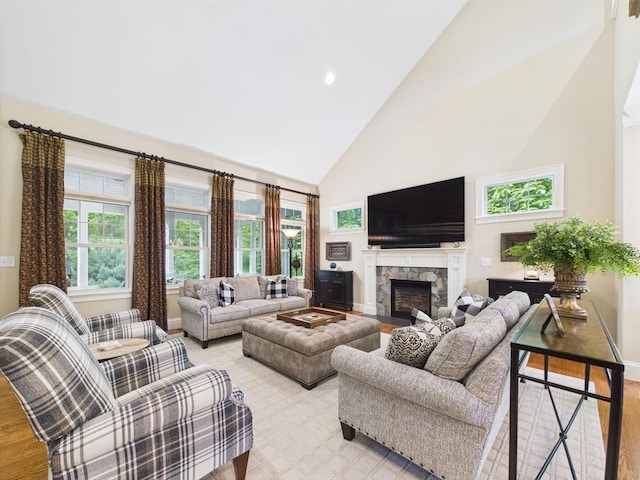 20 Davenport Ln Unit 20, Hopkinton, MA 01748 - living room featuring high vaulted ceiling, baseboards, a fireplace, light wood-style floors, and recessed lighting