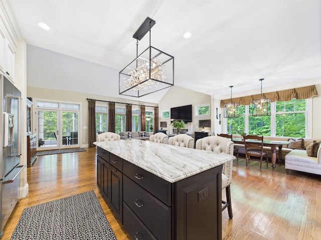 20 Davenport Ln Unit 20, Hopkinton, MA 01748 - kitchen with open floor plan, a chandelier, a kitchen breakfast bar, high end fridge, and healthy amount of natural light