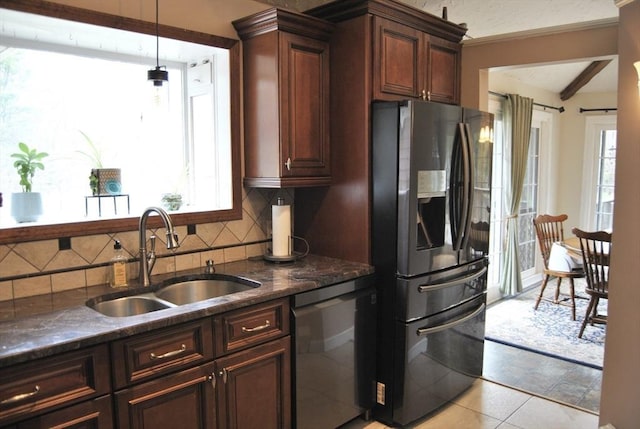 kitchen featuring a sink, decorative backsplash, stainless steel refrigerator with ice dispenser, dishwasher, and plenty of natural light
