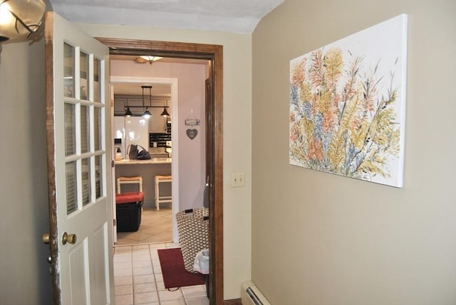 hallway with light tile patterned floors