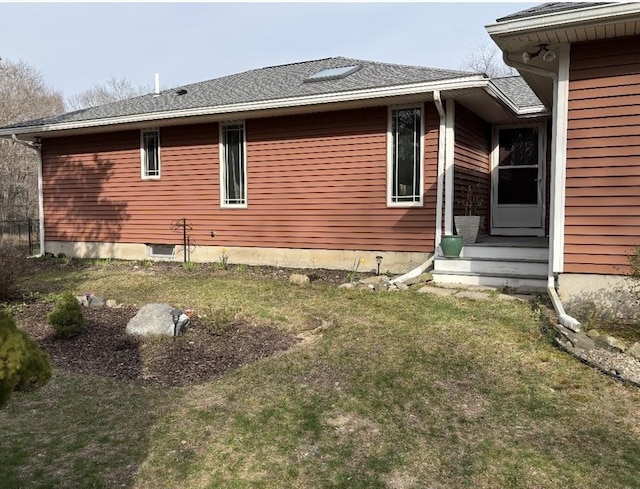 view of property exterior with a lawn