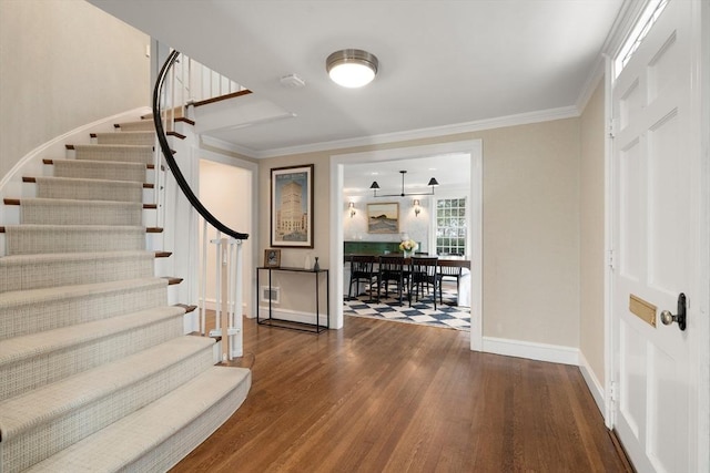 interior space with crown molding and wood-type flooring