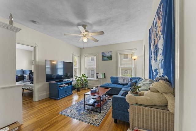 35 Ibbetson, Somerville, MA 02143 - living area with light wood-style flooring, ceiling fan, a textured ceiling, and baseboards