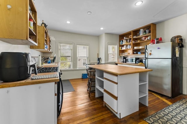35 Ibbetson, Somerville, MA 02143 - kitchen with open shelves, appliances with stainless steel finishes, butcher block countertops, dark wood-style floors, and recessed lighting