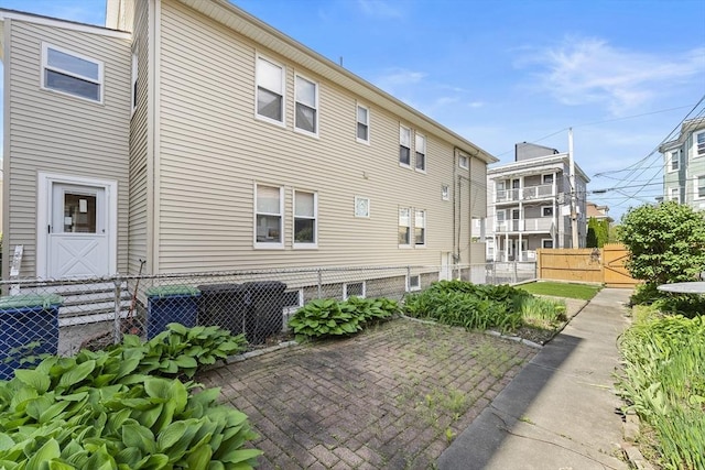 35 Ibbetson, Somerville, MA 02143 - back of house featuring central AC and a patio area