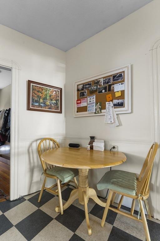 35 Ibbetson, Somerville, MA 02143 - dining room featuring tile patterned floors and a wainscoted wall