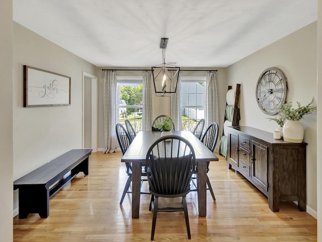 119 Esten Rd, Stoughton, MA 02072 - dining room featuring a chandelier, light wood finished floors, and baseboards