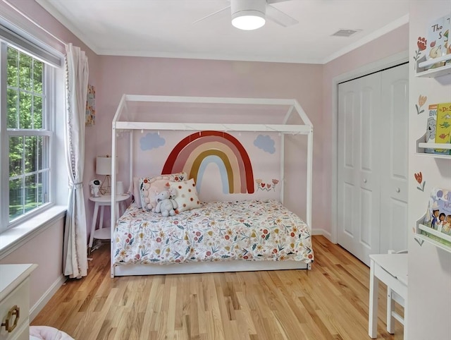 119 Esten Rd, Stoughton, MA 02072 - bedroom featuring wood finished floors, a closet, ornamental molding, and a ceiling fan