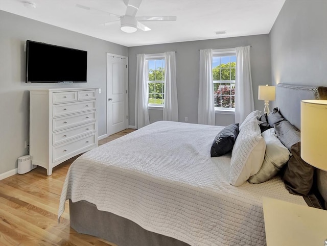 119 Esten Rd, Stoughton, MA 02072 - bedroom with light wood-type flooring, baseboards, and a ceiling fan