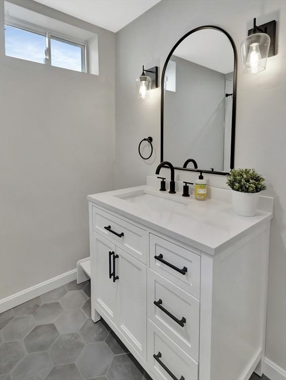 119 Esten Rd, Stoughton, MA 02072 - bathroom featuring vanity and baseboards