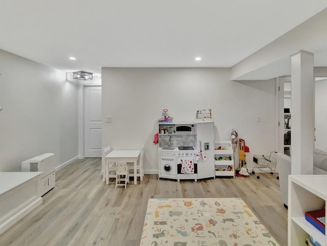 119 Esten Rd, Stoughton, MA 02072 - rec room with wood finished floors, recessed lighting, and baseboards