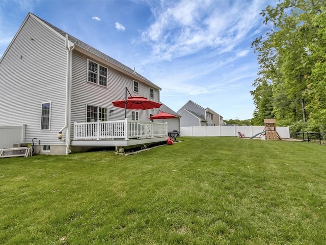 119 Esten Rd, Stoughton, MA 02072 - rear view of house featuring a playground and a wooden deck