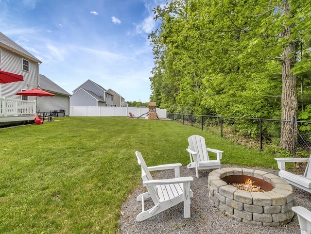 119 Esten Rd, Stoughton, MA 02072 - view of yard with a fire pit, a playground, and a wooden deck