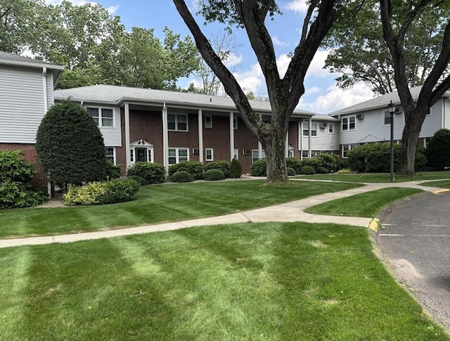 80 Brush Hill Ave Unit 19, West Springfield, MA 01089 - view of front facade featuring a front lawn and brick siding