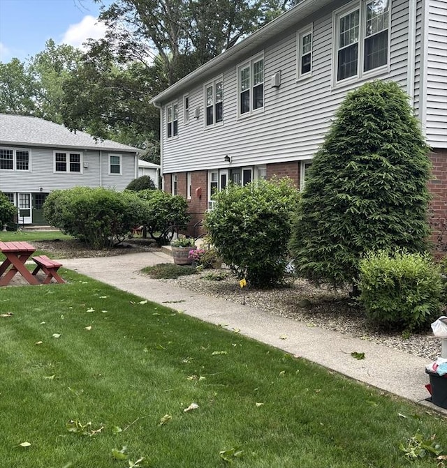 80 Brush Hill Ave Unit 19, West Springfield, MA 01089 - back of house featuring a yard and brick siding