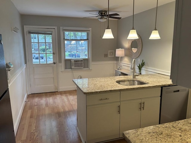 80 Brush Hill Ave Unit 19, West Springfield, MA 01089 - kitchen featuring cooling unit, wood finished floors, a ceiling fan, stainless steel dishwasher, and wainscoting