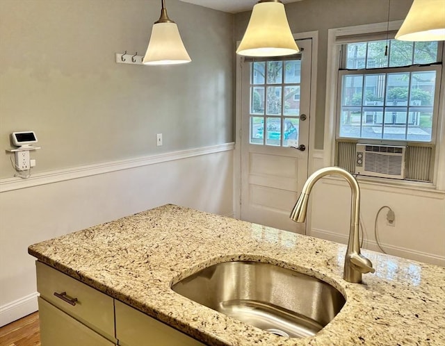 80 Brush Hill Ave Unit 19, West Springfield, MA 01089 - kitchen featuring healthy amount of natural light, decorative light fixtures, cooling unit, and light stone countertops