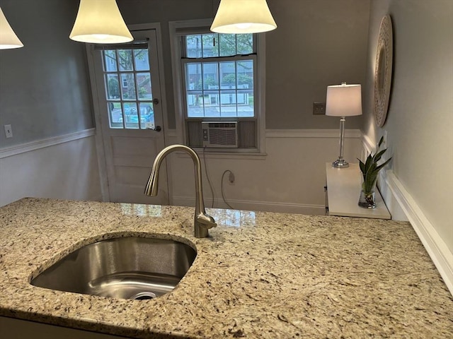 80 Brush Hill Ave Unit 19, West Springfield, MA 01089 - kitchen view of light stone counters, cooling unit, and decorative light fixtures