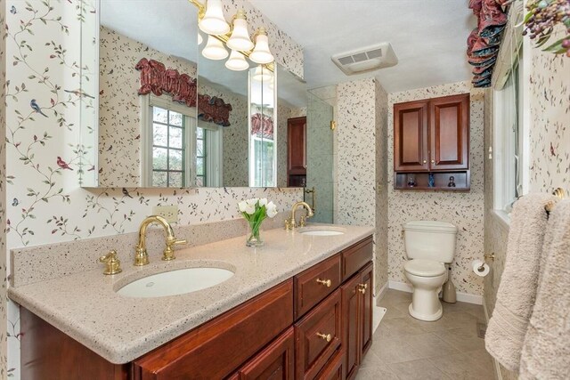 bathroom with visible vents, a sink, tile patterned floors, and toilet