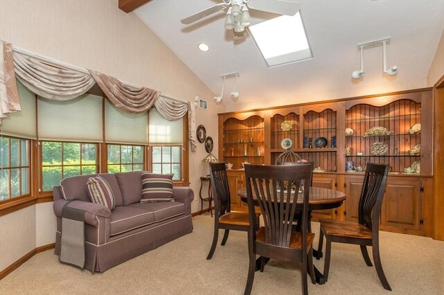 dining area with a ceiling fan, visible vents, baseboards, lofted ceiling, and carpet