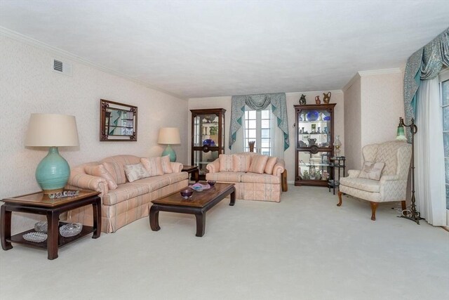 carpeted living area with crown molding and visible vents