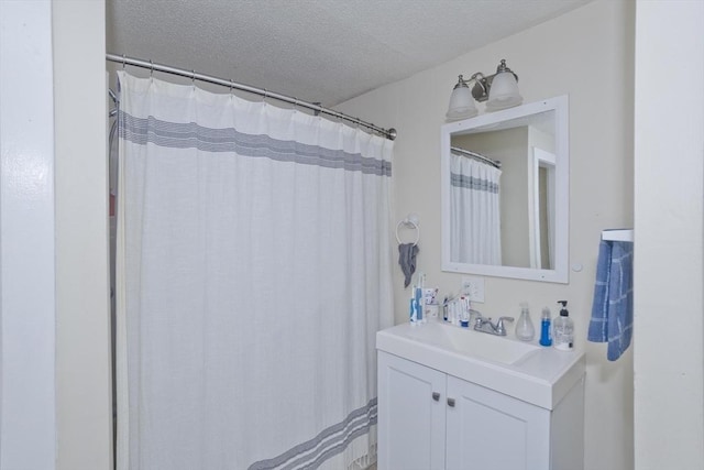 bathroom featuring vanity and a textured ceiling