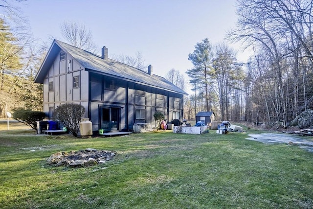 back of house featuring a yard