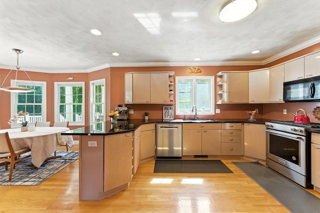 22 Campbell Rd, Middleton, MA 01949 - kitchen featuring stainless steel appliances, a peninsula, open shelves, plenty of natural light, and ornamental molding