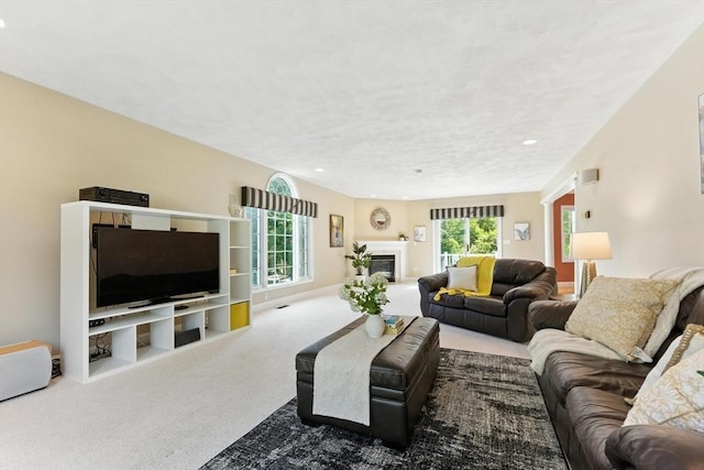 22 Campbell Rd, Middleton, MA 01949 - carpeted living room featuring a glass covered fireplace and recessed lighting