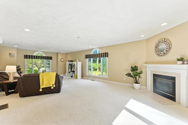 22 Campbell Rd, Middleton, MA 01949 - living area featuring plenty of natural light, a fireplace with flush hearth, recessed lighting, and carpet floors