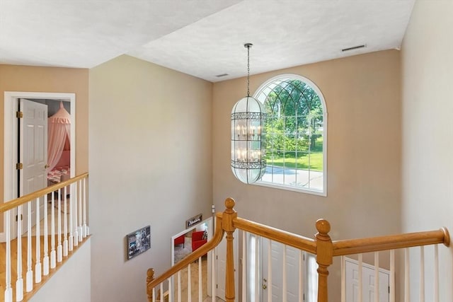 22 Campbell Rd, Middleton, MA 01949 - stairs featuring healthy amount of natural light and a chandelier