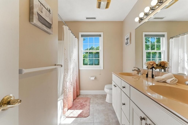 22 Campbell Rd, Middleton, MA 01949 - bathroom featuring healthy amount of natural light, double vanity, and tile patterned floors