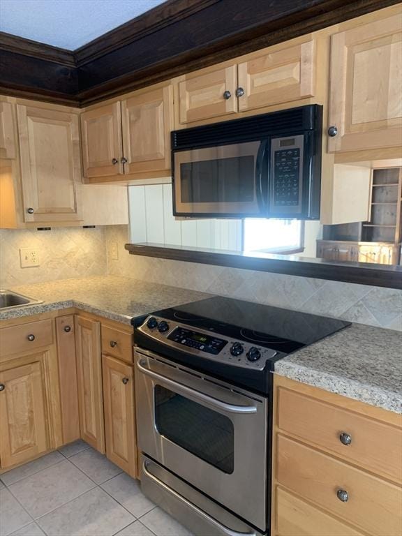 kitchen featuring stainless steel range with electric cooktop, backsplash, light brown cabinets, and light tile patterned floors