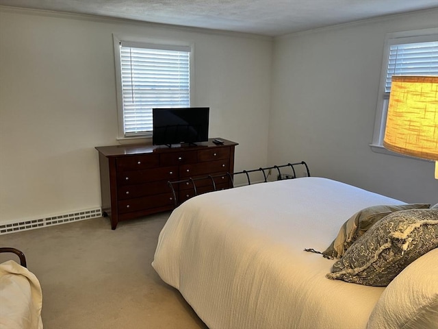 bedroom with a baseboard radiator, carpet, and ornamental molding