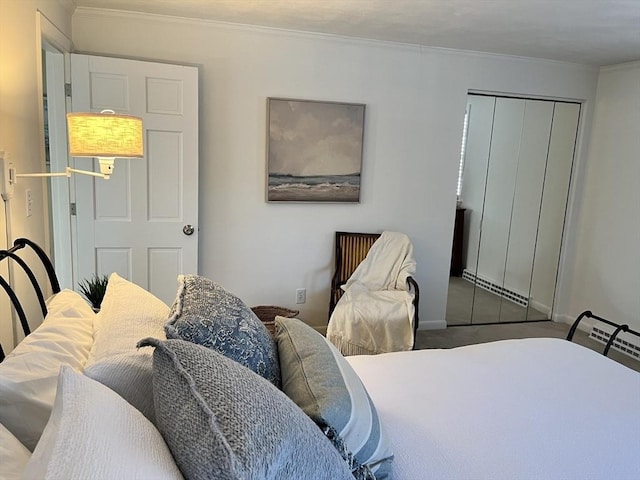 bedroom with ornamental molding and a closet