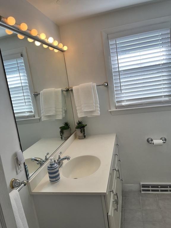 bathroom featuring tile patterned flooring, vanity, and visible vents