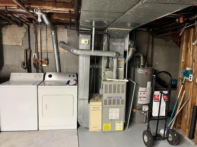 utilities featuring gas water heater and washer and dryer