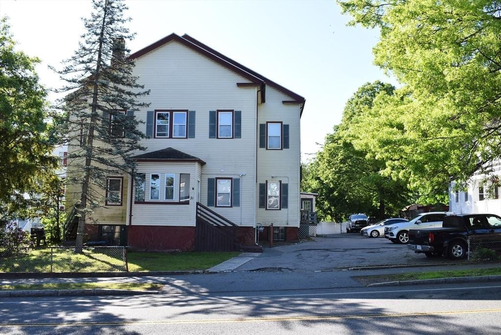 31 N St, Randolph, MA 02368 - view of front of house with uncovered parking and a chimney