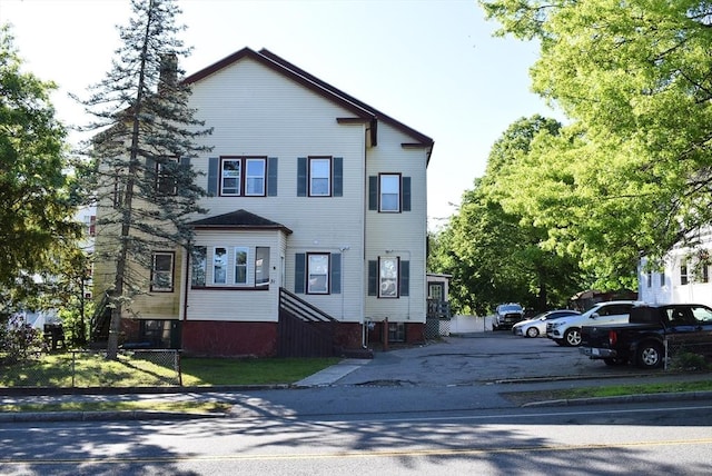 31 N St, Randolph, MA 02368 - view of front of house with uncovered parking and a chimney