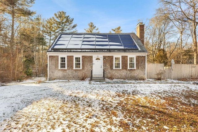 view of front of house featuring solar panels