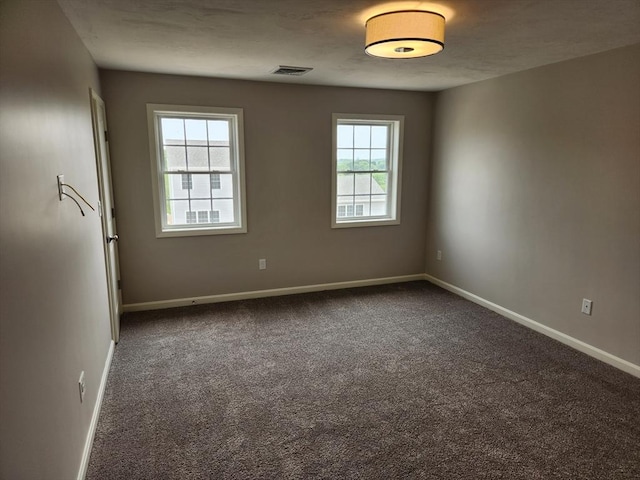 56 Kelly Ln, Lynn, MA 01904 - unfurnished room with dark carpet and baseboards