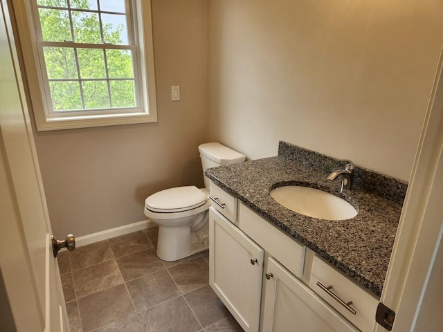 56 Kelly Ln, Lynn, MA 01904 - half bath with vanity, toilet, baseboards, and tile patterned flooring