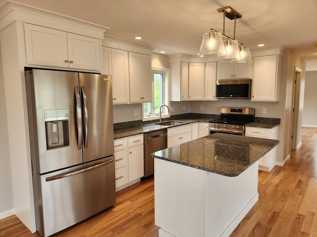 56 Kelly Ln, Lynn, MA 01904 - kitchen featuring stainless steel appliances, a sink, recessed lighting, light wood-style flooring, and white cabinetry