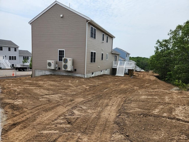 56 Kelly Ln, Lynn, MA 01904 - back of house with ac unit, stairway, and a deck